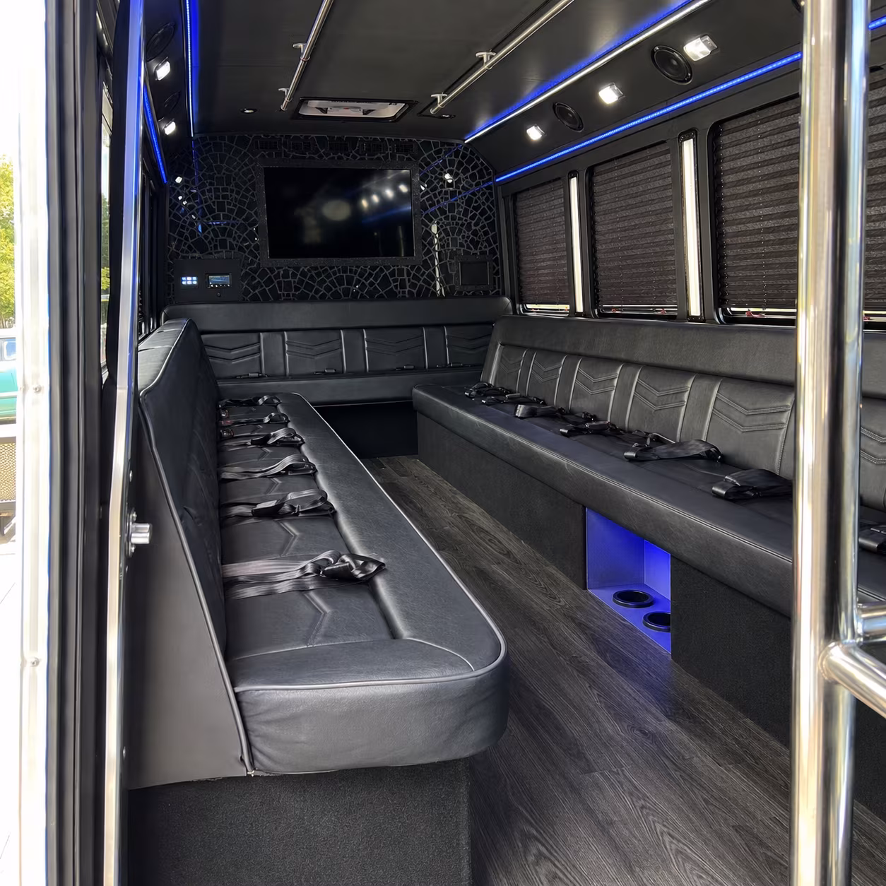 Wedding guests seated inside a party bus serving Newark